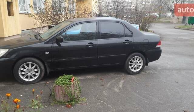 Черный Мицубиси Лансер, объемом двигателя 1.6 л и пробегом 215 тыс. км за 3900 $, фото 1 на Automoto.ua