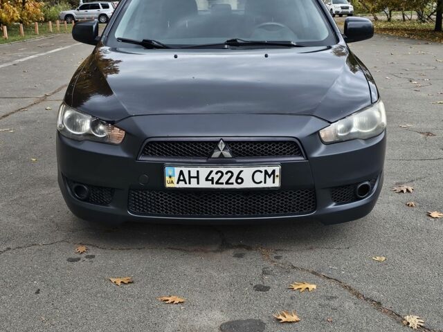 Черный Мицубиси Лансер, объемом двигателя 2 л и пробегом 115 тыс. км за 5000 $, фото 2 на Automoto.ua