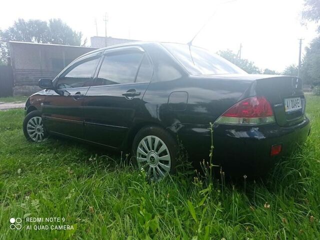 Чорний Міцубісі Lancer, об'ємом двигуна 1.58 л та пробігом 400 тис. км за 3700 $, фото 15 на Automoto.ua