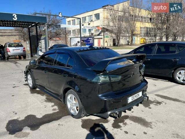 Черный Мицубиси Лансер, объемом двигателя 2 л и пробегом 226 тыс. км за 7200 $, фото 2 на Automoto.ua