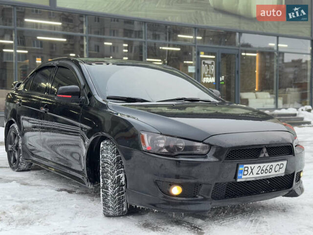 Черный Мицубиси Лансер, объемом двигателя 2 л и пробегом 215 тыс. км за 6600 $, фото 7 на Automoto.ua