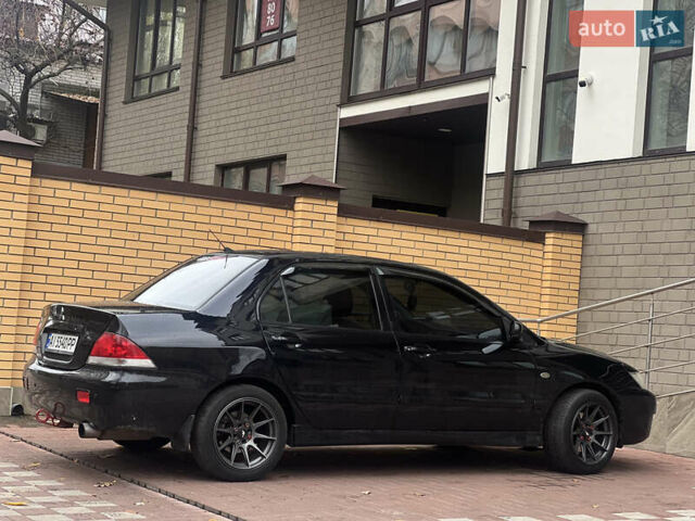 Черный Мицубиси Лансер, объемом двигателя 1.6 л и пробегом 211 тыс. км за 5700 $, фото 11 на Automoto.ua