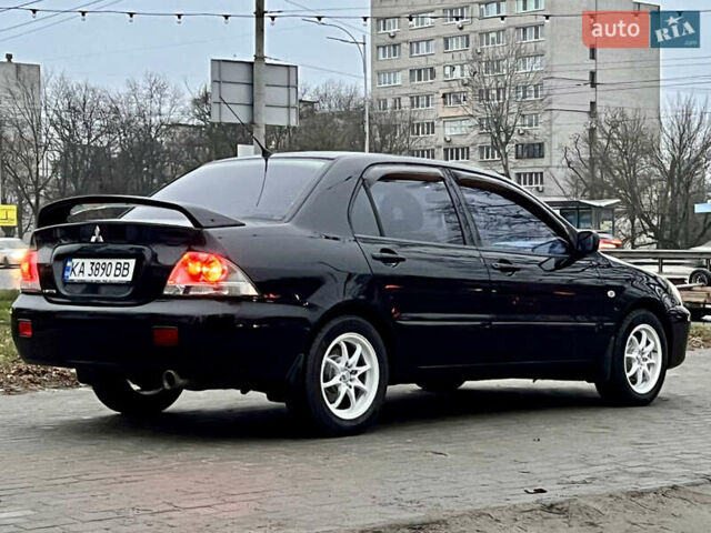 Чорний Міцубісі Lancer, об'ємом двигуна 1.6 л та пробігом 303 тис. км за 4350 $, фото 1 на Automoto.ua