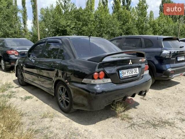 Чорний Міцубісі Lancer, об'ємом двигуна 2 л та пробігом 161 тис. км за 4300 $, фото 3 на Automoto.ua