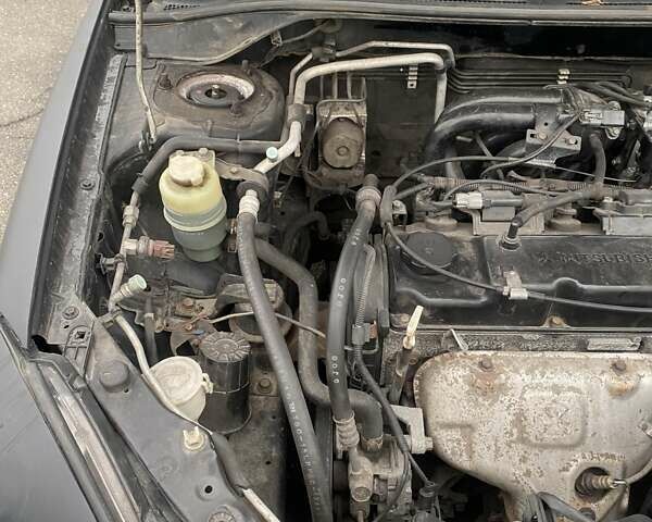 Черный Мицубиси Лансер, объемом двигателя 1.58 л и пробегом 263 тыс. км за 4000 $, фото 19 на Automoto.ua