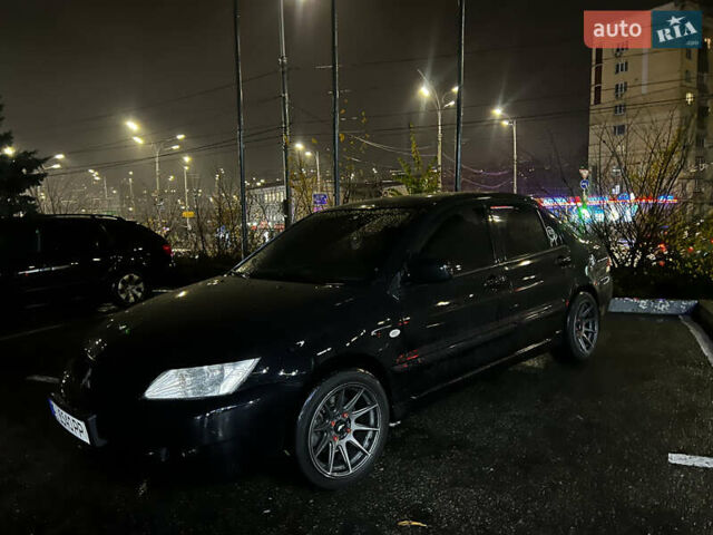 Черный Мицубиси Лансер, объемом двигателя 1.6 л и пробегом 211 тыс. км за 5700 $, фото 16 на Automoto.ua