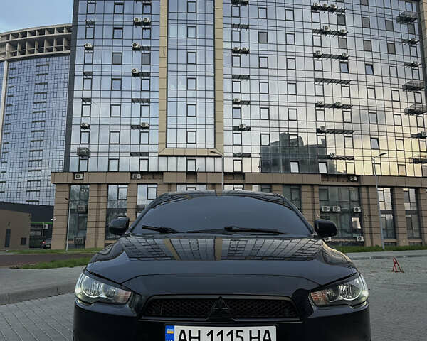 Черный Мицубиси Лансер, объемом двигателя 2 л и пробегом 245 тыс. км за 6200 $, фото 1 на Automoto.ua
