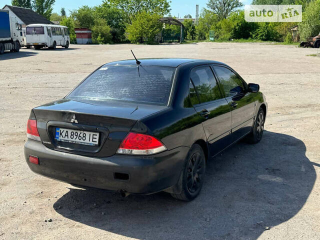 Чорний Міцубісі Lancer, об'ємом двигуна 1.6 л та пробігом 220 тис. км за 4000 $, фото 5 на Automoto.ua