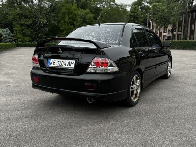 Чорний Міцубісі Lancer, об'ємом двигуна 2 л та пробігом 222 тис. км за 4900 $, фото 3 на Automoto.ua