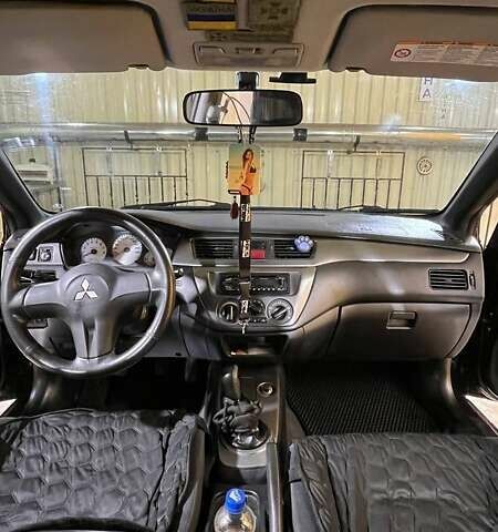 Черный Мицубиси Лансер, объемом двигателя 1.6 л и пробегом 249 тыс. км за 5000 $, фото 10 на Automoto.ua