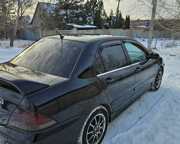 Чорний Міцубісі Lancer, об'ємом двигуна 1.6 л та пробігом 240 тис. км за 3500 $, фото 3 на Automoto.ua