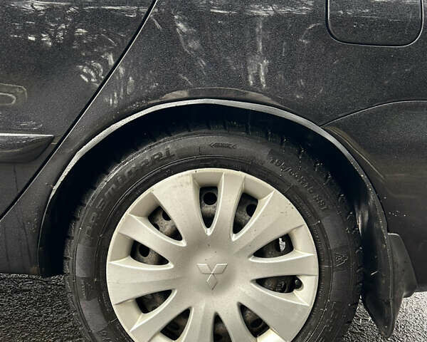 Черный Мицубиси Лансер, объемом двигателя 1.58 л и пробегом 254 тыс. км за 5000 $, фото 10 на Automoto.ua