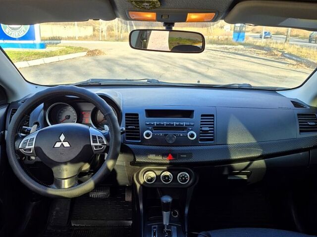 Черный Мицубиси Лансер, объемом двигателя 2 л и пробегом 224 тыс. км за 7000 $, фото 3 на Automoto.ua