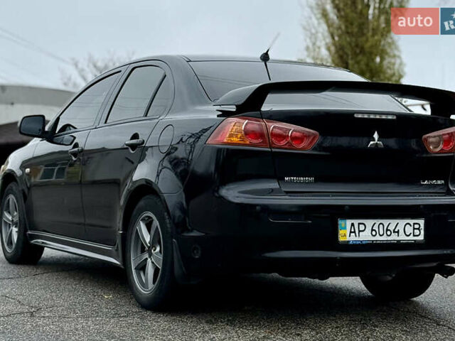 Черный Мицубиси Лансер, объемом двигателя 2 л и пробегом 215 тыс. км за 5500 $, фото 10 на Automoto.ua
