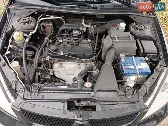 Чорний Міцубісі Lancer, об'ємом двигуна 1.58 л та пробігом 227 тис. км за 4100 $, фото 8 на Automoto.ua