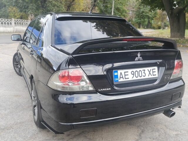 Міцубісі Lancer 2007 у Кам'янське (Дніпродзержинськ) на Automoto.ua Чорний Міцубісі Lancer, об'ємом двигуна 2 л та пробігом 268 тис. км за 5999 $, фото 3 на Automoto.ua