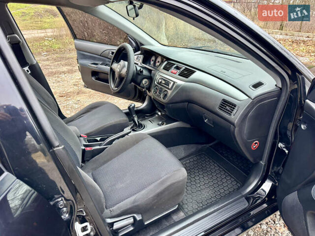 Черный Мицубиси Лансер, объемом двигателя 1.6 л и пробегом 216 тыс. км за 4990 $, фото 17 на Automoto.ua