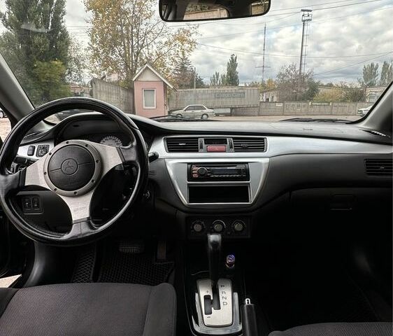 Чорний Міцубісі Lancer, об'ємом двигуна 2 л та пробігом 143 тис. км за 5400 $, фото 6 на Automoto.ua