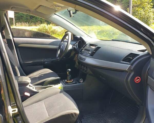 Черный Мицубиси Лансер, объемом двигателя 1.5 л и пробегом 240 тыс. км за 6900 $, фото 9 на Automoto.ua