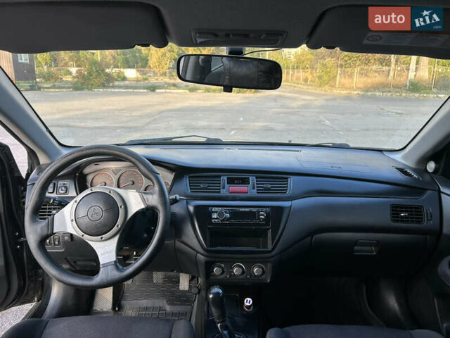 Чорний Міцубісі Lancer, об'ємом двигуна 2 л та пробігом 280 тис. км за 4600 $, фото 43 на Automoto.ua