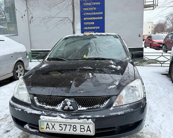 Черный Мицубиси Лансер, объемом двигателя 1.58 л и пробегом 265 тыс. км за 3550 $, фото 3 на Automoto.ua