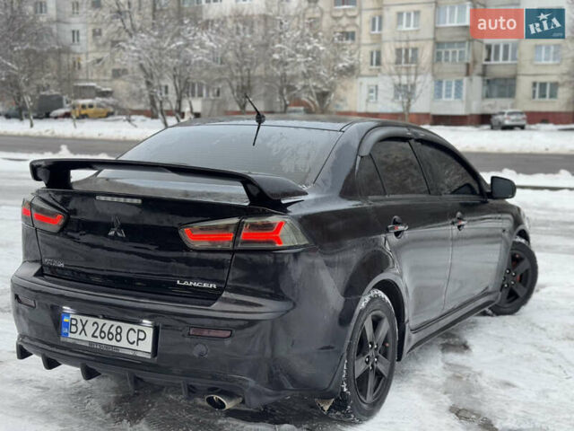 Черный Мицубиси Лансер, объемом двигателя 2 л и пробегом 215 тыс. км за 6600 $, фото 8 на Automoto.ua