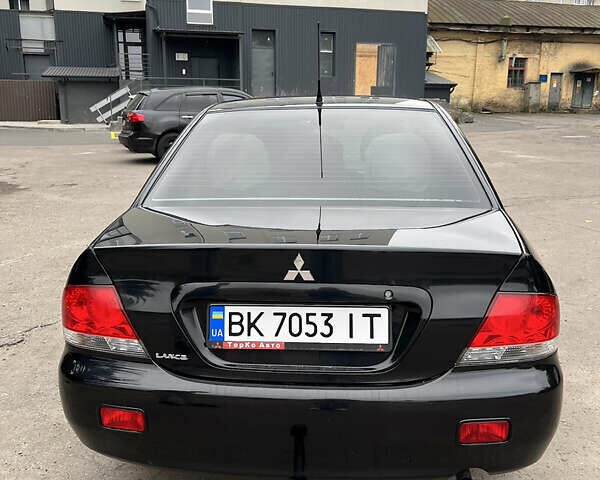 Чорний Міцубісі Lancer, об'ємом двигуна 1.58 л та пробігом 256 тис. км за 4200 $, фото 5 на Automoto.ua
