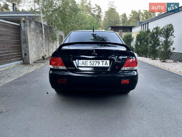 Чорний Міцубісі Lancer, об'ємом двигуна 1.58 л та пробігом 278 тис. км за 4800 $, фото 6 на Automoto.ua