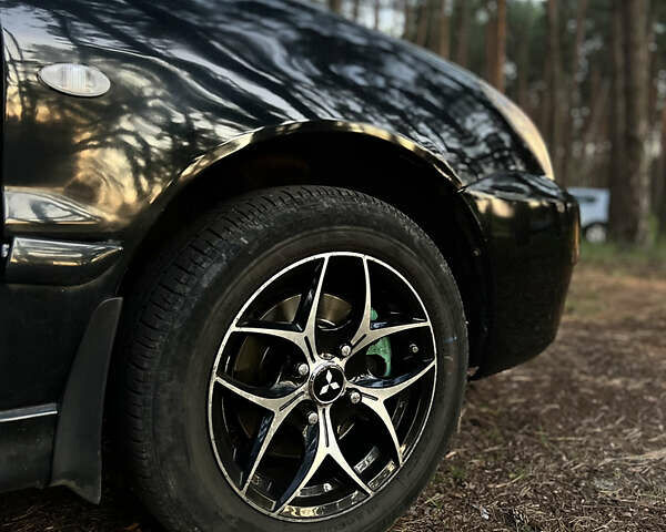 Чорний Міцубісі Lancer, об'ємом двигуна 1.58 л та пробігом 224 тис. км за 3900 $, фото 2 на Automoto.ua