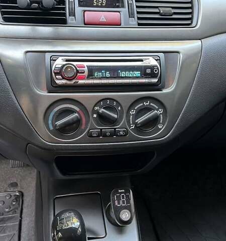 Чорний Міцубісі Lancer, об'ємом двигуна 1.58 л та пробігом 135 тис. км за 4100 $, фото 12 на Automoto.ua
