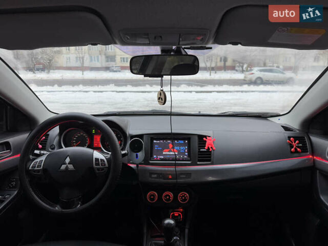 Черный Мицубиси Лансер, объемом двигателя 2 л и пробегом 215 тыс. км за 6600 $, фото 25 на Automoto.ua
