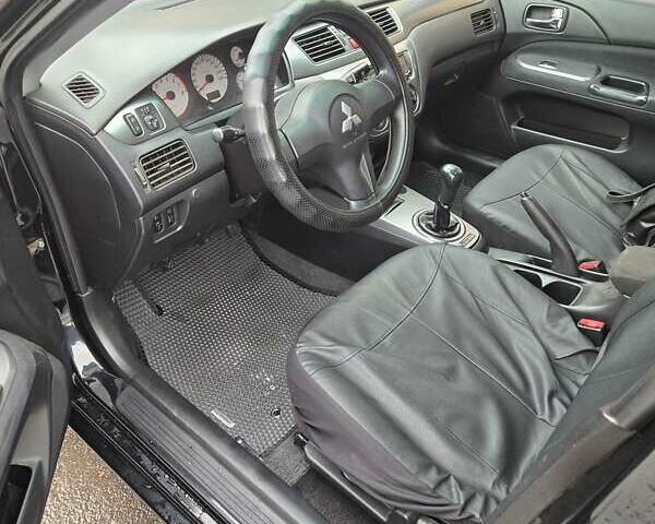 Мицубиси Лансер 2007 в Кривом Роге на Automoto.ua Черный Мицубиси Лансер, объемом двигателя 1.6 л и пробегом 200 тыс. км за 4900 $, фото 9 на Automoto.ua