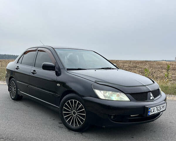 Чорний Міцубісі Lancer, об'ємом двигуна 1.6 л та пробігом 212 тис. км за 4700 $, фото 1 на Automoto.ua
