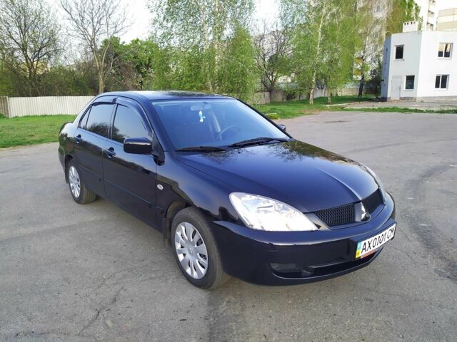 Черный Мицубиси Лансер, объемом двигателя 1.6 л и пробегом 32 тыс. км за 9000 $, фото 7 на Automoto.ua