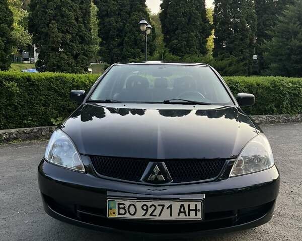 Черный Мицубиси Лансер, объемом двигателя 1.6 л и пробегом 131 тыс. км за 4350 $, фото 3 на Automoto.ua