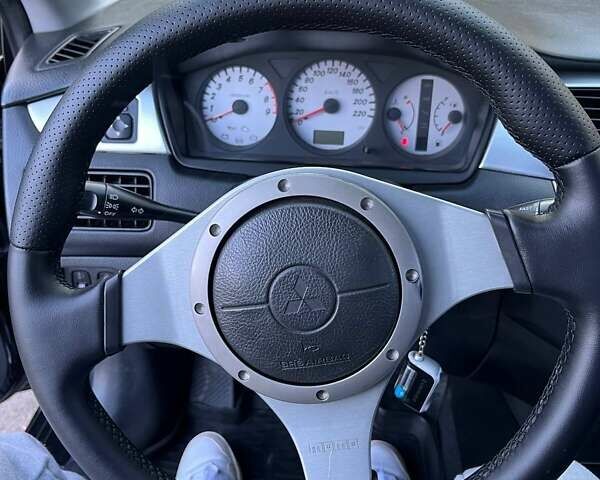 Черный Мицубиси Лансер, объемом двигателя 2 л и пробегом 280 тыс. км за 5400 $, фото 12 на Automoto.ua