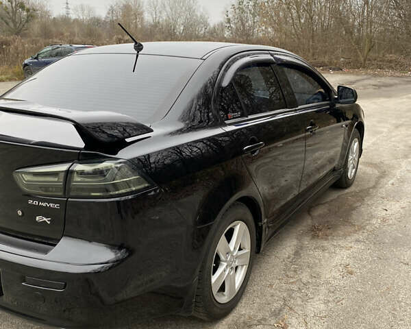 Черный Мицубиси Лансер, объемом двигателя 2 л и пробегом 164 тыс. км за 8300 $, фото 11 на Automoto.ua