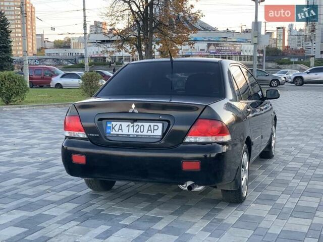 Чорний Міцубісі Lancer, об'ємом двигуна 1.58 л та пробігом 237 тис. км за 4300 $, фото 4 на Automoto.ua