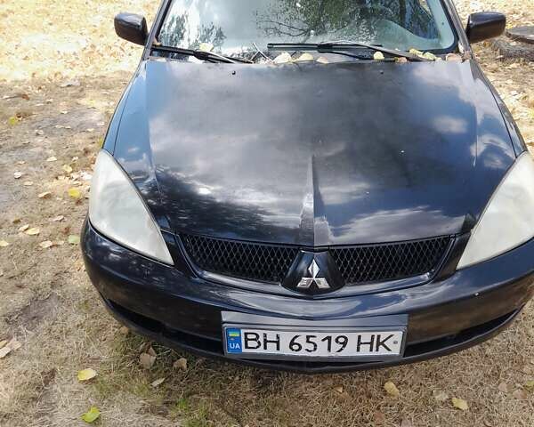 Чорний Міцубісі Lancer, об'ємом двигуна 1.6 л та пробігом 267 тис. км за 4100 $, фото 6 на Automoto.ua