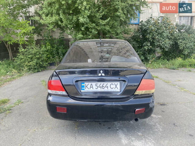 Чорний Міцубісі Lancer, об'ємом двигуна 1.6 л та пробігом 397 тис. км за 1500 $, фото 10 на Automoto.ua