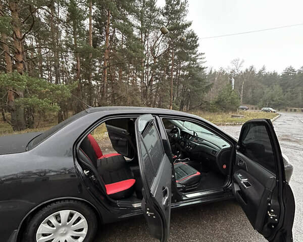 Черный Мицубиси Лансер, объемом двигателя 1.58 л и пробегом 254 тыс. км за 5000 $, фото 17 на Automoto.ua