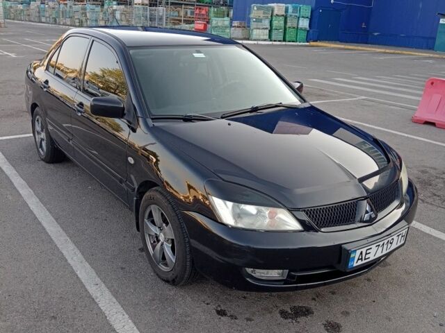 Черный Мицубиси Лансер, объемом двигателя 1.6 л и пробегом 301 тыс. км за 4300 $, фото 1 на Automoto.ua