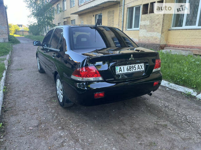 Чорний Міцубісі Lancer, об'ємом двигуна 1.58 л та пробігом 164 тис. км за 4750 $, фото 7 на Automoto.ua