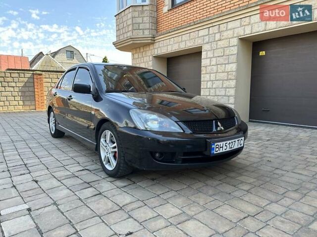 Черный Мицубиси Лансер, объемом двигателя 2 л и пробегом 272 тыс. км за 5514 $, фото 4 на Automoto.ua