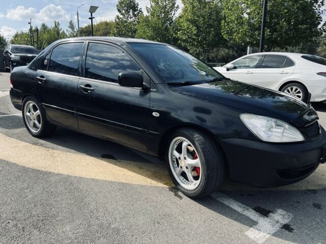 Чорний Міцубісі Lancer, об'ємом двигуна 1.6 л та пробігом 228 тис. км за 3300 $, фото 4 на Automoto.ua