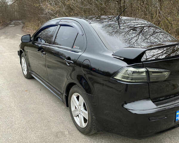 Черный Мицубиси Лансер, объемом двигателя 2 л и пробегом 164 тыс. км за 8300 $, фото 10 на Automoto.ua