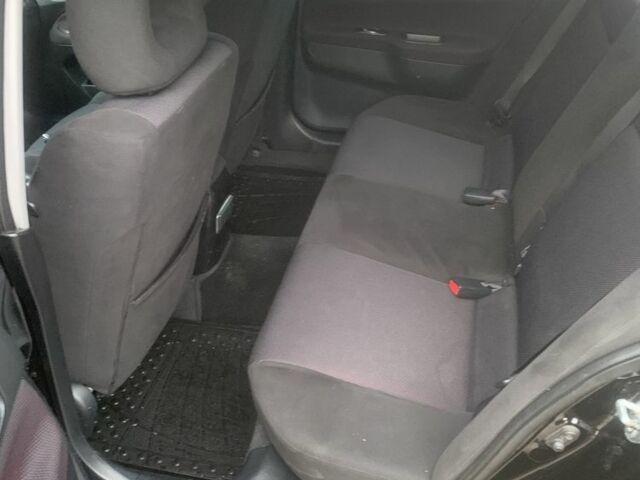 Черный Мицубиси Лансер, объемом двигателя 2 л и пробегом 240 тыс. км за 5600 $, фото 6 на Automoto.ua