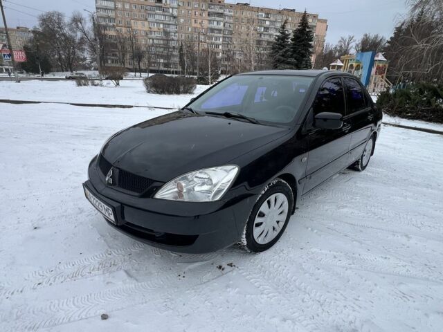 Чорний Міцубісі Lancer, об'ємом двигуна 1.6 л та пробігом 260 тис. км за 3999 $, фото 1 на Automoto.ua