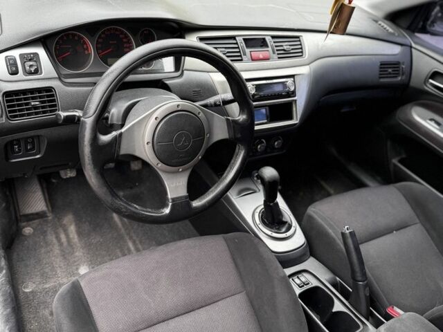 Чорний Міцубісі Lancer, об'ємом двигуна 2 л та пробігом 222 тис. км за 4900 $, фото 7 на Automoto.ua