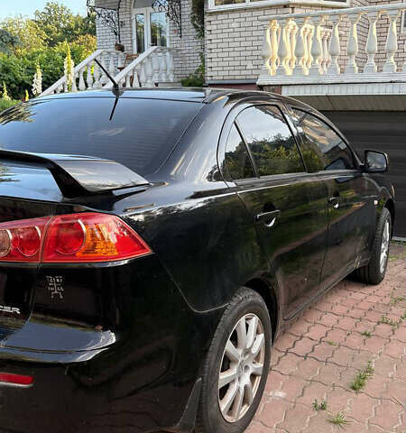 Черный Мицубиси Лансер, объемом двигателя 1.5 л и пробегом 111 тыс. км за 7500 $, фото 5 на Automoto.ua